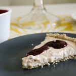 Vegan custard tart with oatmeal lavender crust and blueberry sauce