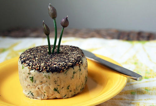 Pepper-crusted cashew cheese with herbs