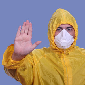 Main in raincoat with mask © Ricardo Saraiva/dreamstime.com