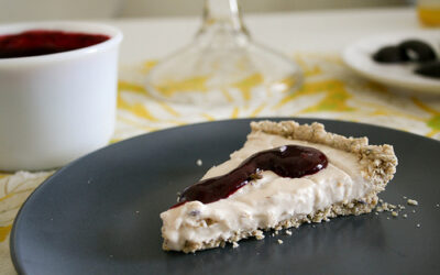 Vegan custard tart with oatmeal lavender crust and blueberry sauce