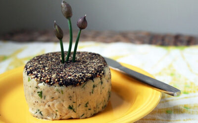 Pepper-crusted cashew cheese with herbs